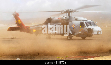 A U.S. Navy Sikorsky SH-60B Seahawk helicopter, flown by Lt. Brian Roberts, assigned to Helicopter Anti-Submarine Squadron Ligh Stock Photo