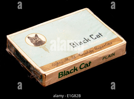 The Black Cat Extra Mild cigarette pack is a product from a well-known  brand. It offers a milder smoking experience, catering to consumers seeking  a smoother alternative to traditional cigarettes Stock Photo -