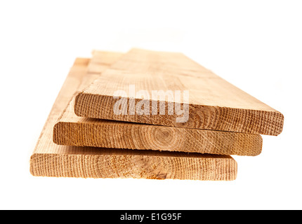 Three cedar one by six inch wood planks on white background Stock Photo