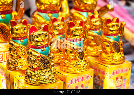 Lucky fortune cats at a Hong Kong market stall Stock Photo