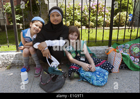 Three Girl Scouts pose for a photo at The Kings County Memorial Day Parade in the Bay Ridge Section of Brooklyn, NY, 2014. Stock Photo