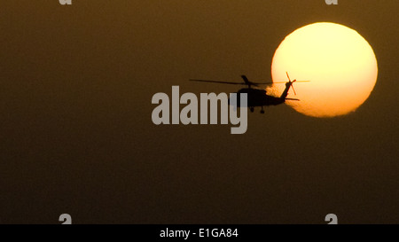 A U.S. Navy HH-60H Seahawk helicopter assigned to Helicopter Anti-Submarine Squadron (HS) 15 conducts plane guard duties for th Stock Photo