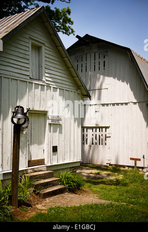An old barn with a one room school house in Hendersonville North Carolina Stock Photo