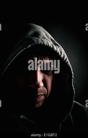 Violent hooded mugger Stock Photo
