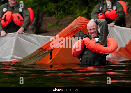 U.S. Air Force Lt. Col. Daniel E. Gabrielli comes up after swimming under a parachute canopy in the St. Croix River during wate Stock Photo