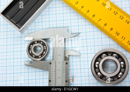 setsquare and calliper with bearing on graph paper Stock Photo