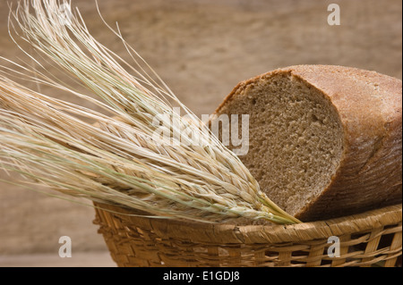 rye bread and ears of corn in the basket Stock Photo
