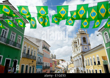 Brazilian flag bunting fluttering over historic city center colonial architecture of Pelourinho Salvador da Bahia Brazil Stock Photo