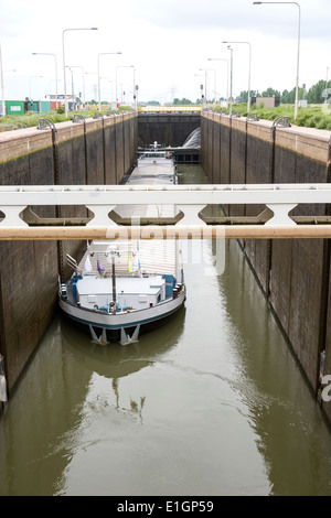 bulk carrier ship in the sluice at the river maas Holland Stock Photo