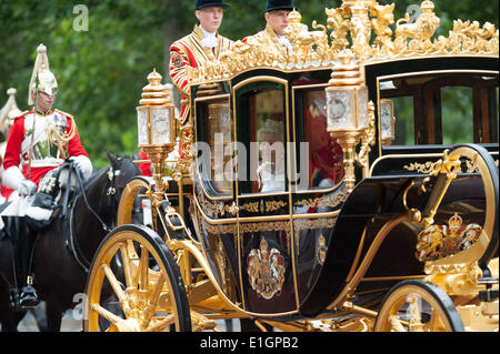 London, UK. 4th June 2014. Queen Elizabeth II is driven through the Mall in Central London in her ceremonial carriage on her way to attend the State Opening of Parliament, on Wednesday June 4, 2014. Credit:  Heloise/Alamy Live News Stock Photo