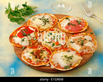 Varied minipizzas. Recipe available. Stock Photo