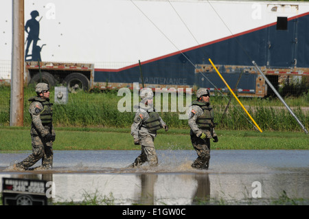 U.S. Army Spc. Ryan Lindberg, left, Spc. Michael Young, center, and Staff Sgt. Jason Lothspeich, right, both with the 817th Eng Stock Photo