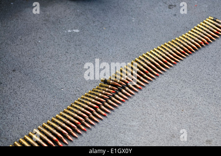 Ammunition belt for a General Purpose Machine Gun (GPMG) with red-tipped tracer rounds Stock Photo