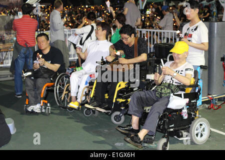 Hong Kong. 04th June, 2014. Thousands take part in the candlelight vigil in Hong Kong. Credit:  Robert SC Kemp/Alamy Live News Stock Photo