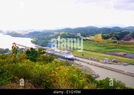 Cruise ship enters the Pedro Miguel lock with construction of the new canal in the background, Panama, Central America. Stock Photo