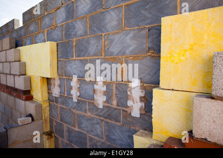 self building house, 100mm insulation bats in masonry cavity wall insulating to current building regulations Stock Photo