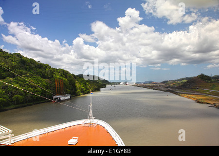 Cruise ship transits Culebra Cut, formerly called Gaillard Cut on a beautiful day with Pedro Miguel lock ahead, Panama canal. Stock Photo