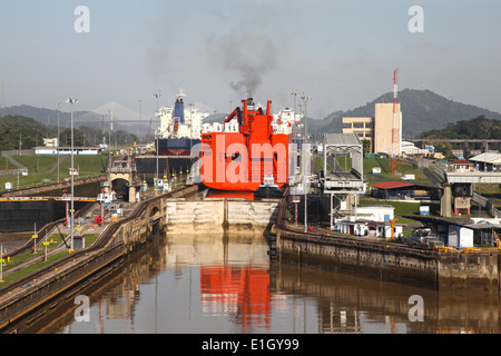 Approaching the Mira Flores lock in the Panama Canal, cargo ships are in the chambers, Panama, Central America. Stock Photo