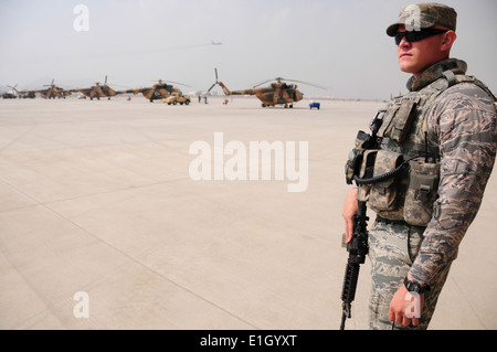 U.S. Air Force Staff Sgt. Kenneth Van Winkle, with the 438th Air Expeditionary Advisory Group, watches the flight line during a Stock Photo