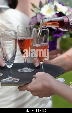 Rose champagne being served at a wedding reception, Stock Photo