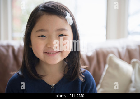 Portrait of young girl in sitting room Stock Photo