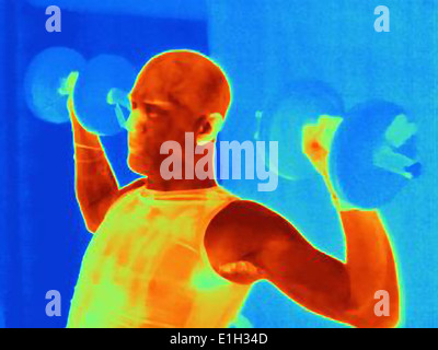 Close up thermal image of young male training with barbell. The image shows the heat produced by the muscles Stock Photo