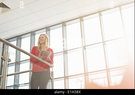 Young woman holding digital tablet Stock Photo