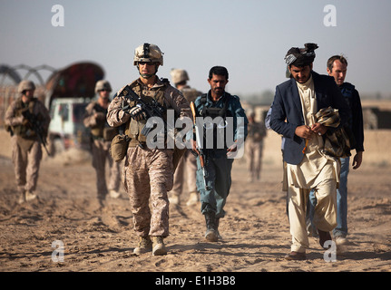 U.S. Marine Corps Lt. Col. Matthew Palma, left, the commander of 3rd Battalion, 3rd Marine Regiment, and Garmsir District Gov. Stock Photo