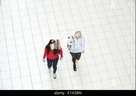 Two young women walking, high angle Stock Photo