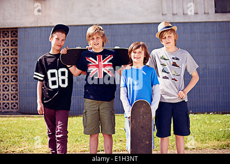 Portrait of boys with skateboards Stock Photo