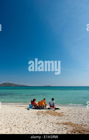 Tourist enjoy the sea at Cala Brandinchi beach, San Teodoro, Sardinia, Italy Stock Photo