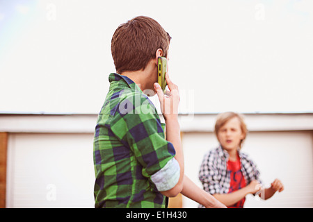 Boy on cell phone Stock Photo