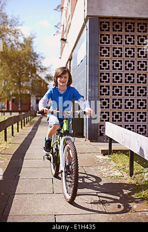 Portrait of boy cycling Stock Photo