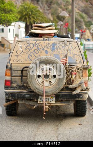 Needs Cleaning. SUV Covered In A Thick Layer Of Dust And Dirt Parked In Avalon, Santa Catalina Island, California. Stock Photo