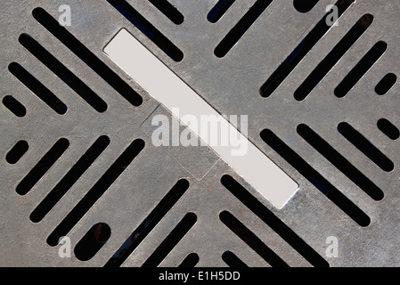 Background closeup of cut out pattern on metal cover plate Stock Photo