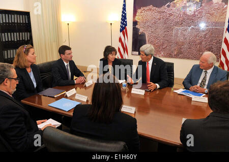 Beirut, Lebanon. 04th June, 2014. US Secretary of State John Kerry speaks with United Nations and Mercy Corps representatives who provide humanitarian services in Lebanon during a surprise visit June 4, 2014 in Beirut, Lebanon. Credit:  Planetpix/Alamy Live News Stock Photo