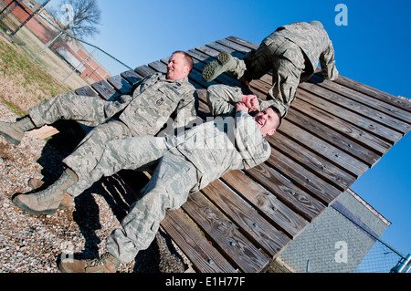 U.S. Air Force Staff Sgt. Ed Nooning, lower right, and Master Sgt. Josh Devine, lower left, both security policemen with the 12 Stock Photo