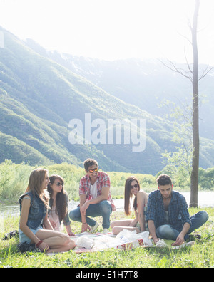 Friends sitting having picnic Stock Photo