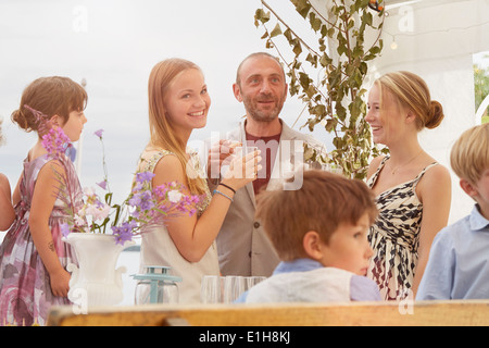 Bride with family and friends at wedding reception Stock Photo