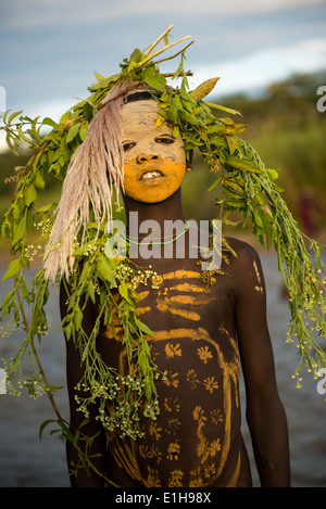 Suri Tribal Child With Body Paint And Decorations In Omo Valley suri-tribal-child-with-body-paint-and-decorations-in-omo-valley