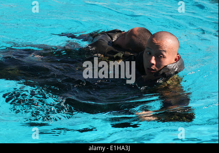 Japan Ground Self-Defense Force (JGSDF) soldiers practice simulated casualty drills during a helocast preparation exercise at M Stock Photo