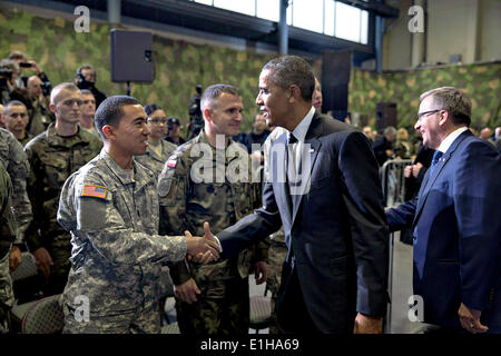 US President Barack Obama greets US and Polish soldiers during a visit to F16 pilots and crew at Okecie Military Airport June 3, 2014 in Warsaw, Poland. The president's visit to Warsaw coincides with the 25th anniversary of Poland emerging from communism. Stock Photo