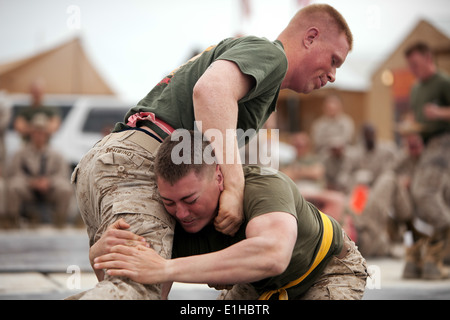 U.S. Marine Lance Cpl. Keith Silva, right, attempts to take down Lance Cpl. Brett P. Schwindt, during a ground fighting tournam Stock Photo