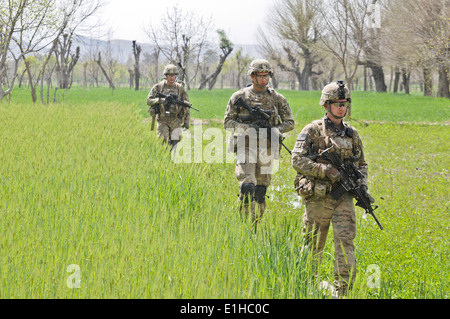 From right, U.S. Army Staff Sgt. Tyler Rux, a squad leader, Sgt. Robert Addington, a team leader, and Spc. Clark Choate, all as Stock Photo