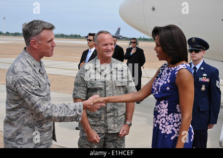 U.S. Air Force Col. Robert Gass, left, the vice commander of the 8th Air Force, shakes hands with first lady Michelle Obama upo Stock Photo