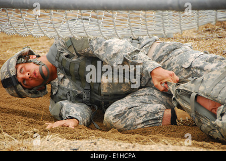 California Army National Guard Staff Sgt. Demetrius McCowan drags a casualty dummy during an obstacle course event in the 2012 Stock Photo