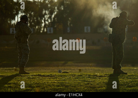 From left, U.S. Army Sgt. Steven Whetstone, with the 2nd Battalion, 25th Infantry Division, and Australian army Warrant Officer Stock Photo