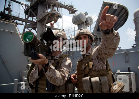 U.S. Marine Corps Cpl. Kevin A. Kohl, right, and Cpl. Mark B. Fentress, both with the 11th Marine Expeditionary Unit, practice Stock Photo