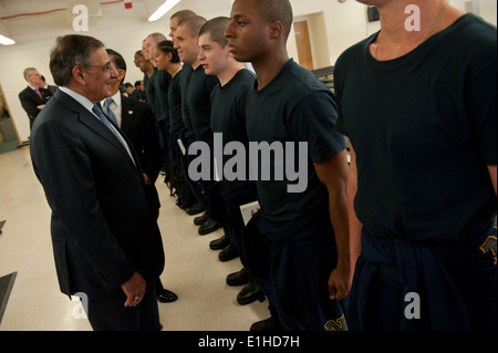 Secretary of Defense Leon E. Panetta greets U.S. Navy recruits at the USS Red Rover facility at the Capt. James A. Lovell Feder Stock Photo