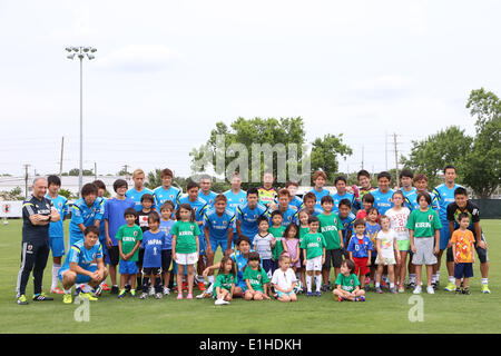 Clearwater, Florida. 3rd June, 2014. Japan team group (JPN) Football/Soccer : Japan's national soccer team Samurai Blue players pose for photos with local children during a training session in Clearwater, Florida . © Kenzaburo Matsuoka/AFLO/Alamy Live News Stock Photo